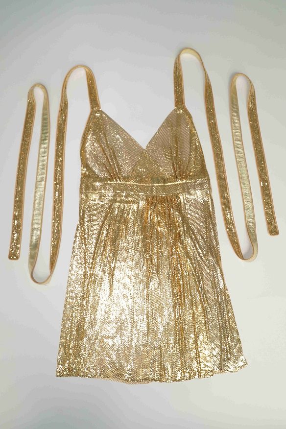 Gold sequin dress with long straps.