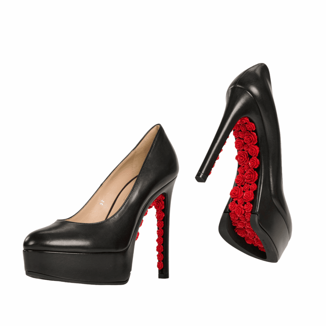 Black high heels with red rose details.