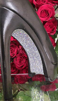 Black high heel with glitter, red roses.