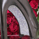 Black high heel with glitter, red roses.