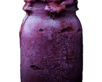 Purple smoothie with berries in a jar.